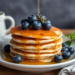 Fluffy vegan blueberry pancakes: a delicious plant-powered treat.