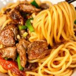 Japchae Unveiled: Delicious Korean glass noodle stir-fry art.