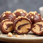 Decadent Keto chocolate peanut butter fat bombs, rich and delicious.