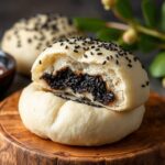 Fluffy steamed black sesame buns, a delicious traditional treat.