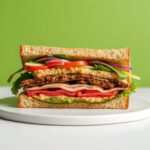 Delicious Tempeh Reuben sandwich, bold flavor, ultimate vegan experience.