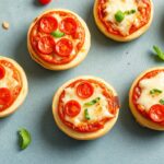 Mini English muffin pizzas: quick, tasty, fun snack.