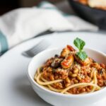 Hearty lentil and mushroom bolognese: ultimate plant-powered twist.
