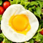 Fresh salad with egg: vibrant sunrise greens for a morning boost.