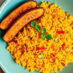 Golden Harmony: Jollof rice and sweet fried plantains.