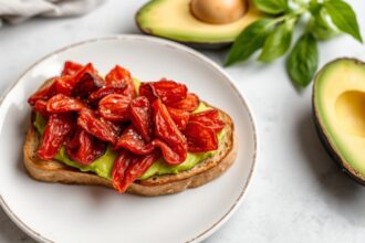 Sun-dried tomato avocado toast, a delicious and irresistible sun-kissed delight.