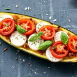 Margherita zucchini boats, fresh and vibrant, a classic flavor twist.
