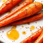 Honey cumin glazed carrots with sweet heat magic.