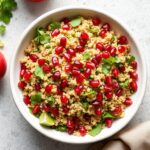 Vibrant quinoa tabbouleh salad with pomegranate seeds.