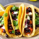Bold bright black bean sweet potato tacos recipe inspiration.