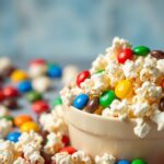 Sweet salty popcorn with M&Ms, a delightful snack mix.