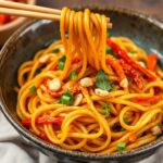 Fiery peanut noodles with crisp, colorful veggies and creamy sauce.