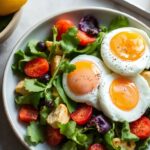 Perfect poached egg breakfast salad: creamy, crisp morning ritual.