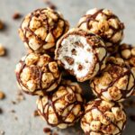 Gooey s'mores popcorn balls: irresistible chocolatey, toasty treat!