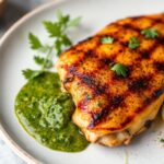 Juicy keto grilled chicken with vibrant chimichurri sauce.