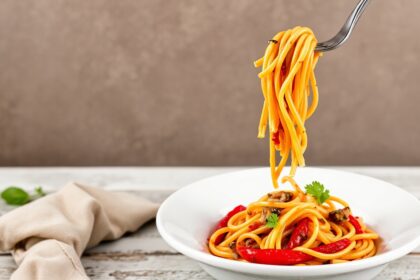 Discover bold flavors: roasted red pepper pasta delight.