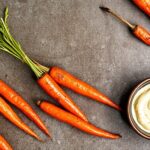 Fiery harissa roasted carrots: sweet, smoky, caramelized.