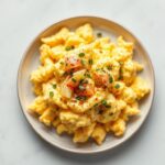Cheesy scrambled eggs with a creamy, classic breakfast twist.