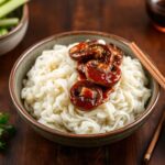Savory hoisin mushrooms on rice noodles.