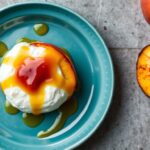 Creamy burrata with grilled peaches and spicy hot honey drizzle.