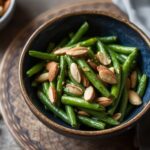 Crunchy Elegance: Sautéed green beans with toasted almonds.