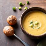 Rich creamy vegan broccoli cheddar soup recipe close-up.
