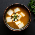 Wholesome miso soup with tofu and seaweed, a perfect vegetarian harmony.