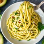 Fresh creamy vegan zucchini noodles with avocado pesto.