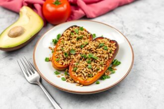 Hearty stuffed roasted vegetables with nutty fonio grain recipe.
