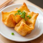 Crispy Crab Rangoon appetizer: tasty origins of this delightful fried wonton.