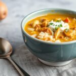 Cozy curried chicken and rice soup, a comforting, flavorful meal.