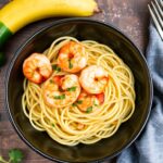 Zucchini noodles with zesty shrimp scampi, a light and flavorful dish.